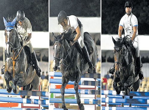 UP IN THE AIR: (From left) Lt. Col. Sandeep Dewan of HEC (astride Almost Heaven), ECE's Rishab Mehta (astride Caprice) and Faiz Rezwan (astride Hugo) during their 4 Bar at the ECE Equestrian Challenge - 2016 at the Palace grounds on Friday. DH PHOTO