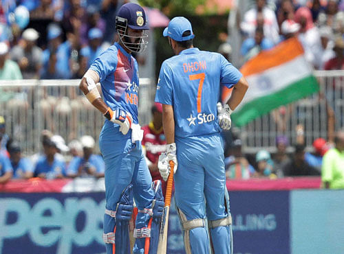 India's Lokesh Rahul, left, and MS Dhoni (7) talks in between overs during the first Twenty20 international cricket match against the West Indies, Saturday, Aug. 27, 2016, in Lauderhill, Fla. AP/PTI