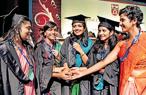 jubilant: Gold medallists (from left) Sonakshi Saxena (3 medals), Ashwini Vaidialingam (5), Gopika Murthy (11), Shreya Prakash (3) and G Deekshitha (3) share their joy at the National Law School of India University convocation in Bengaluru on Sunday.  dh photo