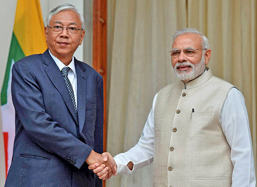 Prime Minister Narendra Modi shakes hands with President of Myanmar U Htin Kyaw before a meeting at Hyderabad house in New Delhi on Monday. PTI Photo