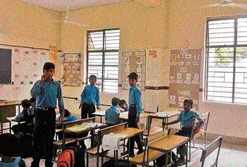 Students have fun as there is no teacher to attend to them at a municipal school in south Delhi's Hauz Khas area.