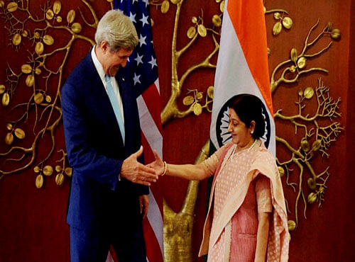 External Affairs Minister Sushma Swaraj shakes hands with U.S. Secretary of State John Kerry at a meeting in New Delhi on Tuesday. PTI Photo