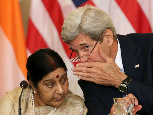 U.S. Secretary of State John Kerry (R) gestures as India's External Affairs Minister Sushma Swaraj looks on during their joint news conference in New Delhi, India, August 30, 2016. REUTERS