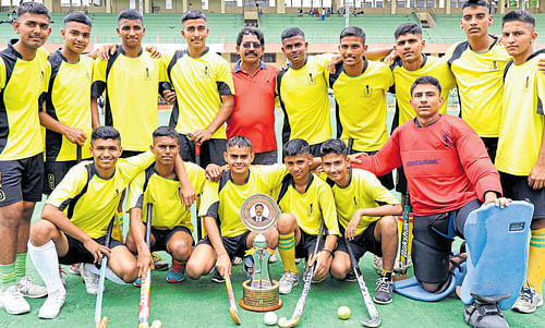 Champions: Rashtriya Military School senior boys' team, winners of the inter-school hockey tournament. Standing (from left) Suraj Dixit, Ajay Kumar, Bharadwaj G, Deepak Antil, Chinnappa (coach), Vikash Kumar, Ayush Choudhary, Amit Kumar, Kush Choudhary, Anil Loura. squatting: Yogesh Seshma, Deepak, Shanu Bhadoura, Vageesh, Aditya Kumar, Anupam Singh. DH Photo