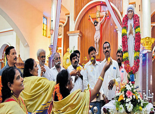People celebrate the sainthood of Mother Teresa at the Immaculate Conception Church in Bengaluru on Sunday. DH PHOTO