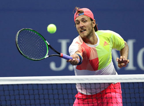 Lucas Pouille of France hits volley against Rafael Nadal of Spain. Geoff Burke-USA TODAY Sports/Reuters