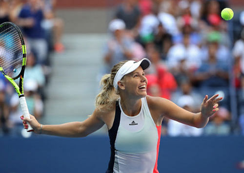 Caroline Wozniacki of Denmark celebrates after winning match point against Madison Keys. Reuters photo