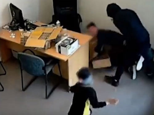 Patel, who was caught up in the violent drama, is seen in the video rushing towards one of the attackers standing over an employee with an axe, and tries to get him to stop his attack. Screen grab.