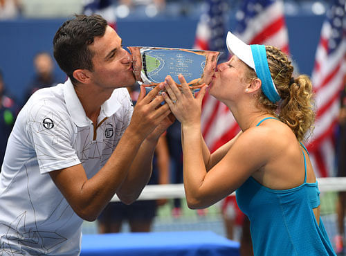 Laura Siegemund of Germany and Mate Pavic of Croatia after beating Coco Vandeweghe and Rajeev Ram of the United States in the mixed doubles final on day twelve of the 2016 U.S. Open tennis tournament at USTA Billie Jean King National Tennis Center. Reuters