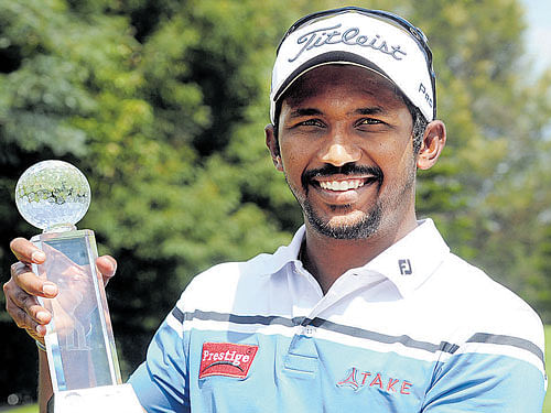 ruling the roost: S Chikkarangappa is a picture of delight as he poses with the PGTI Eagleburg Masters trophy on Friday. dh photo/ srikanta sharma r
