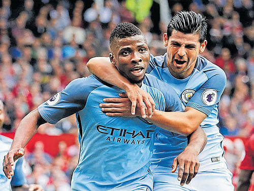 fine strike Manchester City's Kelechi Iheanacho (left)  celebrates with Nolito after scoring against Manchester  United on Saturday. reuters