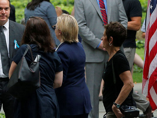 U.S. Democratic presidential candidate Hillary Clinton leaves ceremonies marking the 15th anniversary of the September 11 attacks at the National 9/11 Memorial in New York. REUTERS Photo