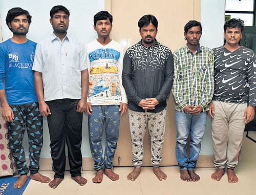 The six persons charged with murder and dacoity bid.  dh photo
