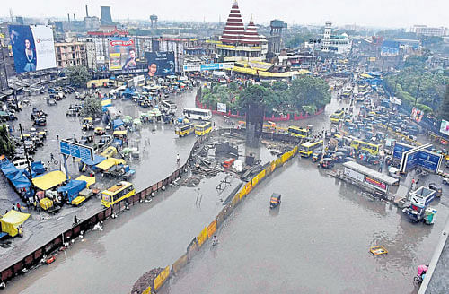inundated: A view of a flooded junction after heavy rain in Patna on Monday. PTI