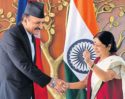 Nepalese Minister of Foreign Affairs Prakash Sharan Mahat greets Sushma Swaraj in New Delhi on Monday. AFP