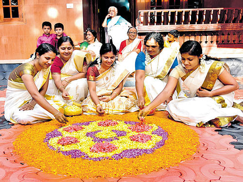 Deepthi, Sneha Latha, Prasanna, Sathi and Ashwathy making a colourful 'pookalam'.