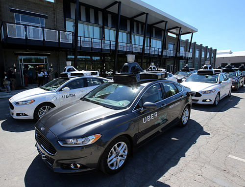 A fleet of Uber's Ford Fusion self driving cars are shown during a demonstration of self-driving automotive technology in Pittsburgh. Reuters Photo