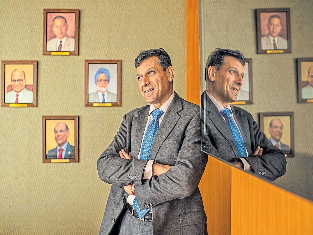 A 2015 file photo shows Dr Raghuram Rajan, the 23rd Governor of the Reserve Bank of India, in his office in Mumbai. Rajan ended his three-year term as governor on Sunday with a warning about worldwide low interest rates. NYT