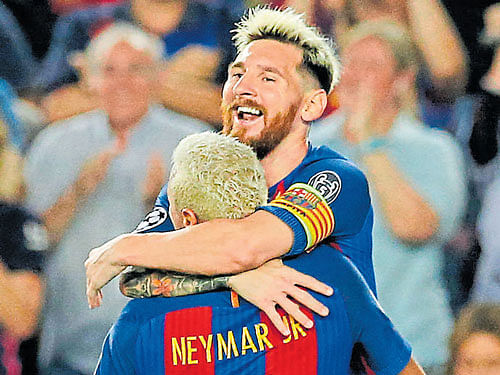 Barcelona's Lionel Messi celebrates with team-mate Neymar after scoring against Celtic on Tuesday. Reuters