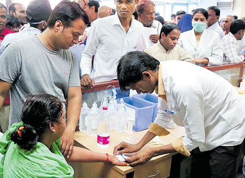 A patient receives treatment at the RML Hospital in New Delhi on Wednesday.