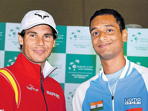fun before action: Spain's Rafael Nadal (left) and India's Ramkumar Ramanathan are all smiles on Thursday. PTI