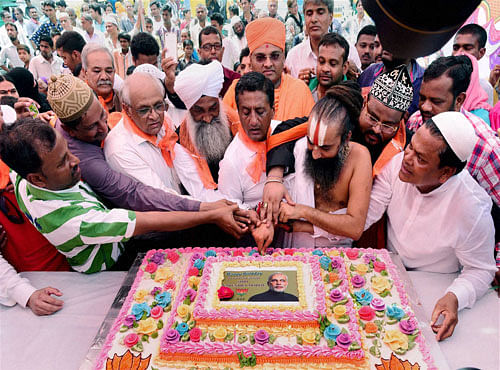 People of all religions celebrate birthday of Prime Minister Narendra Modi in Ahmedabad on Saturday. PTI Photo