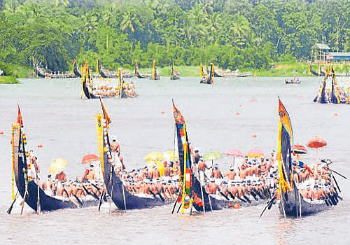 Snake-boats during the ceremonial procession ahead of the Uthrittathi boat race in Aranmula on Saturday.