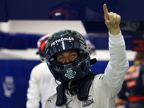 Mercedes' driver Nico Rosberg of Germany celebrates pole position after qualifying session. Reuters Photo.