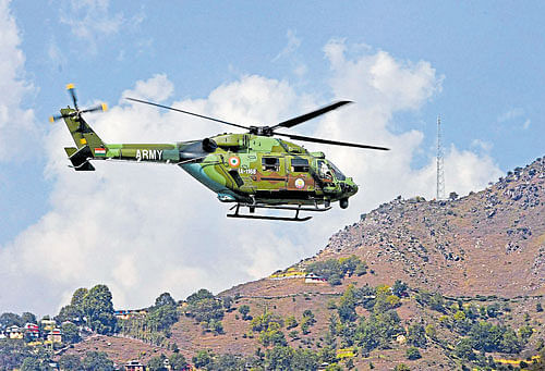 A chopper airlifts injured soldiers after in Uri on Sunday. PTI
