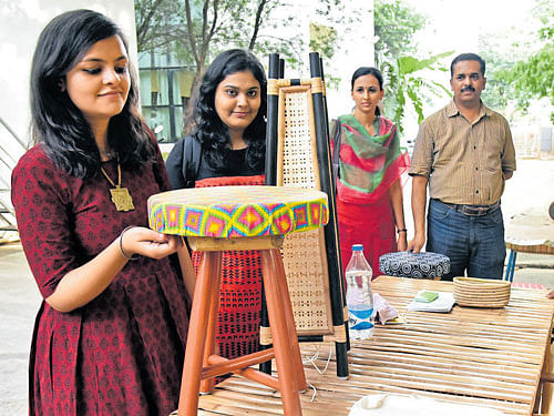 Visitors take a look at the bamboo products on display at an exhibition organised as part  of the World Bamboo Day 2016 at the National Institute of Design in Bengaluru on Sunday.  DH&#8200;Photo
