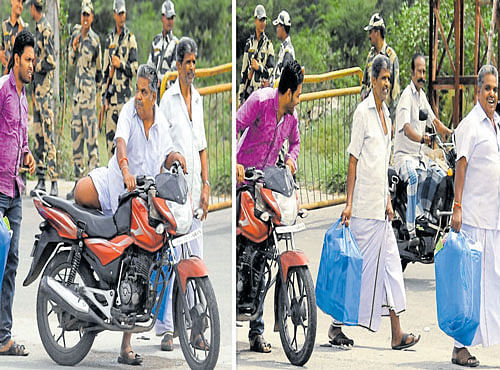 A man fromTamil Nadu gets down from a motorcycle at the inter-state border and walks towards Attibele on the outskirts of Bengaluru to find alternative transport. DH PHOTO
