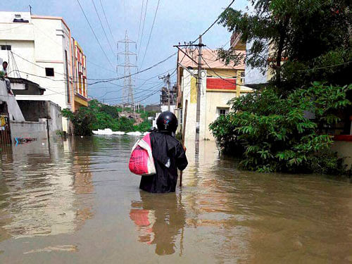 A view of the flooded localities after heavy rain in Hyderabad. PTI Photo.