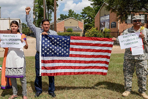 Indians protest in front of Consulate General of Pakistan in Houston on Friday. PTI Photo