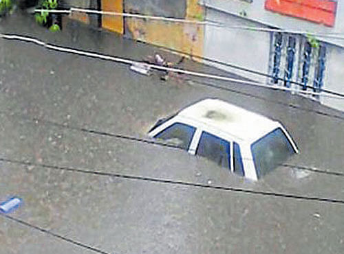 A submerged car in a flooded area of Hyderabad. PTI/ DH PHOTO