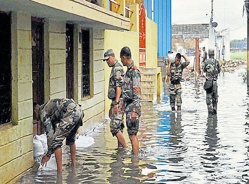 WATERWOES: Army personnel carry out relief and rescue operations in a flood-affected area of Hyderabad. PTI photo