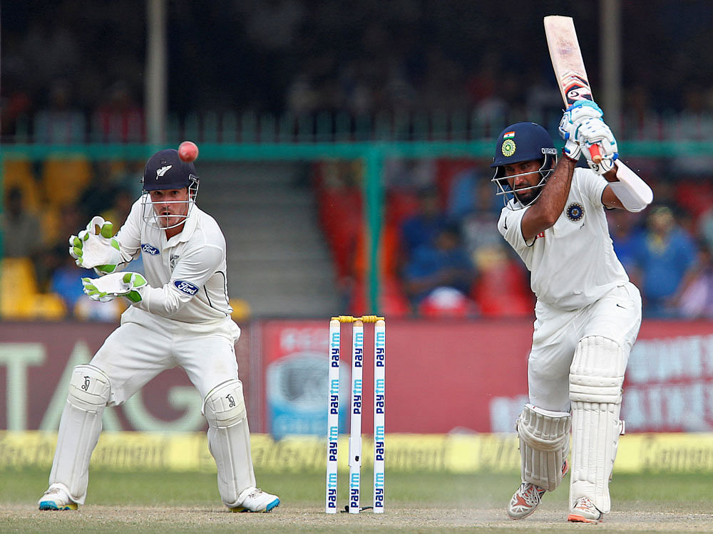 Cheteshwar Pujara plays a shot on the fourth day of the first cricket Test against New Zealand. Reuters