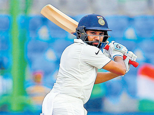 vital knock: Rohit Sharma scored a timely half-century to help India set a formidable target for New Zealand on day four of the first Test at Kanpur on Sunday. reuters