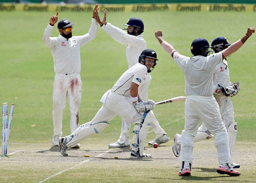 Indian team players celebrate their victory over New Zealand on the final day of the first test match at Green Park in Kanpur on Monday. PTI Photo