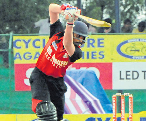 fetch that! Bellary Tuskers' Rohan Kadam drives one to the boundary during his 53 against Belagavi Panthers in their  KPL match at Hubballi on Monday. DH photo
