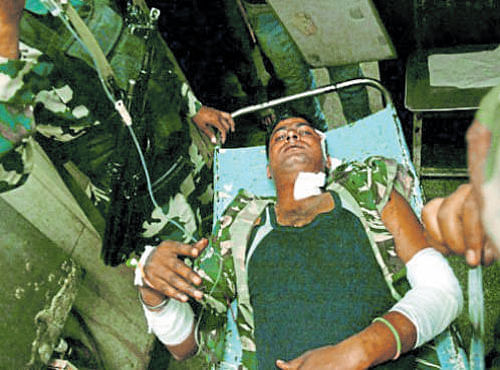 An injured CRPF jawan being shifted to a hospital. PTI