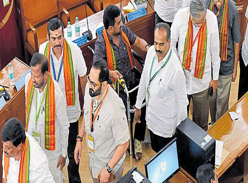 BJP members walk out of the BBMP Council meeting in the middle of the mayoral election when Regional Commissioner MV Jayanthi did not allow MPs Rajeev Chandrasekhar and P C Mohan to cast votes as they were late. DH PHOTO