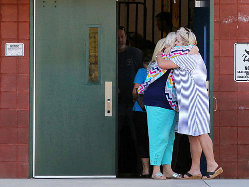 Two teachers hug outside of Townville Elementary School after a shooting in Townville, South Carolina, U.S., September 28, 2016. Reuters Photo.