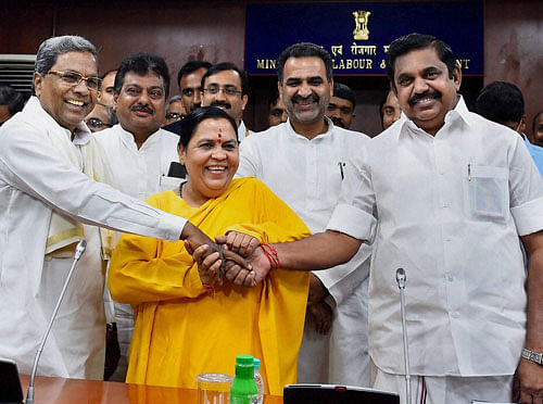 Chief Minister Siddaramaiah and Tamil Nadu Public Works Minister E Palaniswamy greet Union Water Resources Minister Uma Bharti before a meeting convened to discuss the  Cauvery river water sharing issue in New Delhi on Thursday.