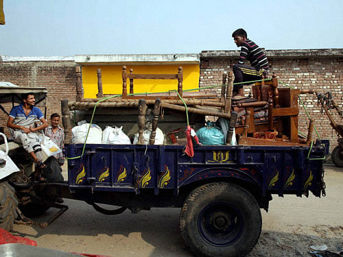 Villagers residing in the close vicinity of the India-Pakistan border evacuate their homes for a safer place, in Gigrial near Jammu on Saturday. PTI Photo