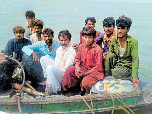 The nine Pakistani nationals who were held along with their boat by a BSF team at Creek area in Bhuj, Gujarat. PTI