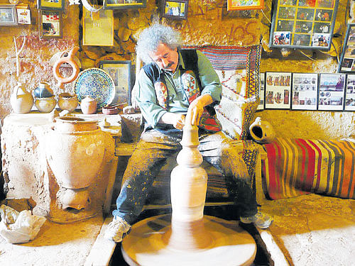 Creative hands Chez Galip  at work at his shop in Avanos, Turkey.