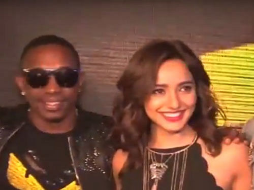 West Indies all-rounder Dwayne Bravo and Neha Sharma. Screen grab.