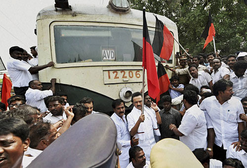 DMK treasurer and former Deputy Chief Minister M K Stalin along with party MLAs and other functionaries stage a rail roko at the Perambur Railway station demanding the constitution of a Cauvery management board in Chennai on Monday. PTI Photo
