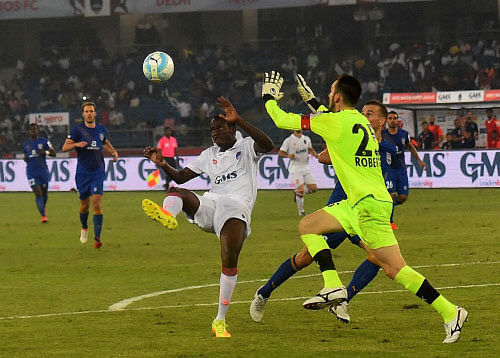Mumbai City FC and Delhi Dynamos FC (white Jersy) players in action during Hero Indian Super League match in New Delhi on Tuesday. PTI Photo