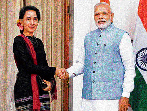 Prime Minister Narendra Modi with Myanmar State Counsellor and Foreign Minister Aung San Suu Kyi ahead of their meeting at Hyderabad House in New Delhi on Wednesday. PTI
